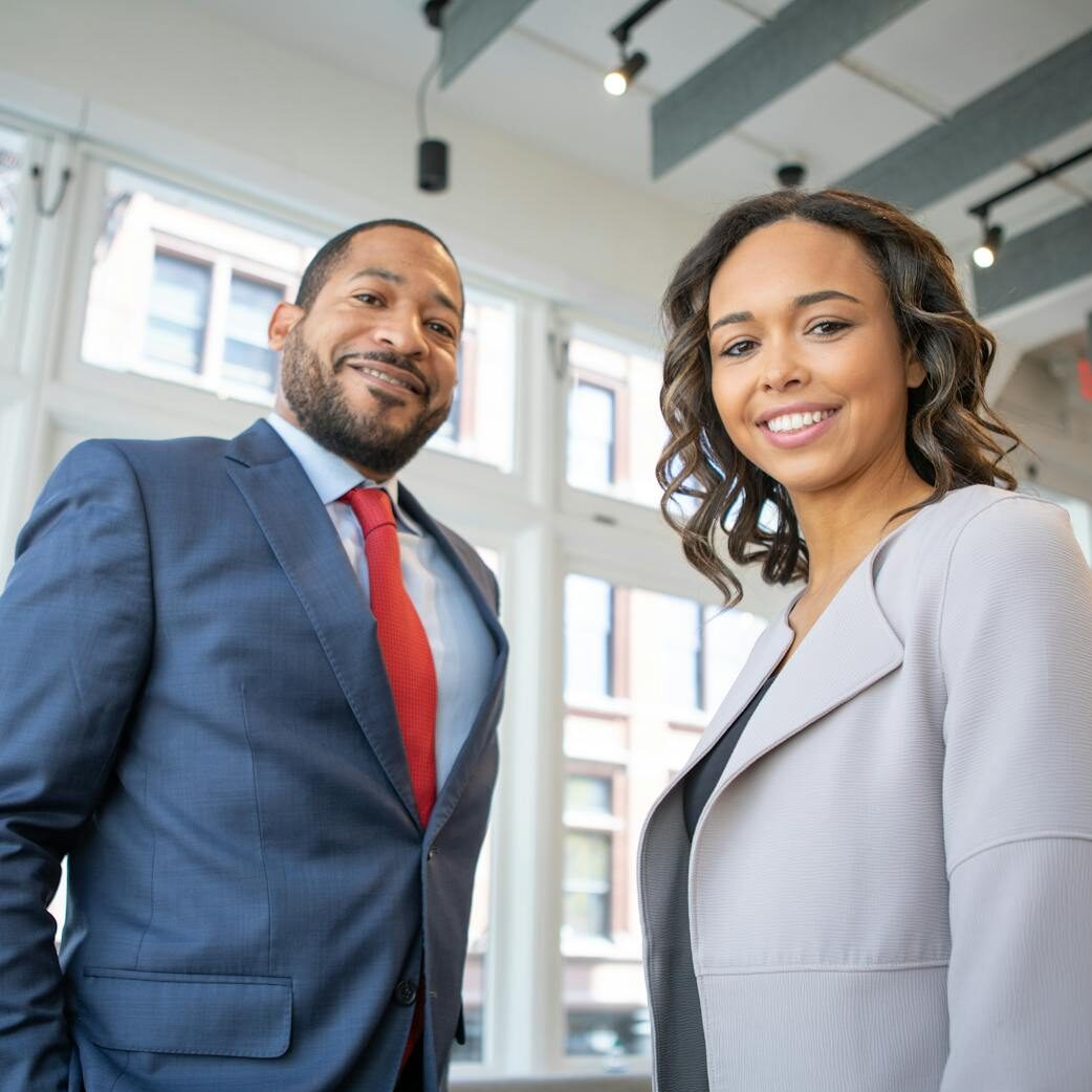 Man and Woman Smiling Inside Building